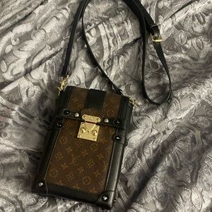 Louis Vuitton
Vertical Trunk Pochette Monogram Canvas